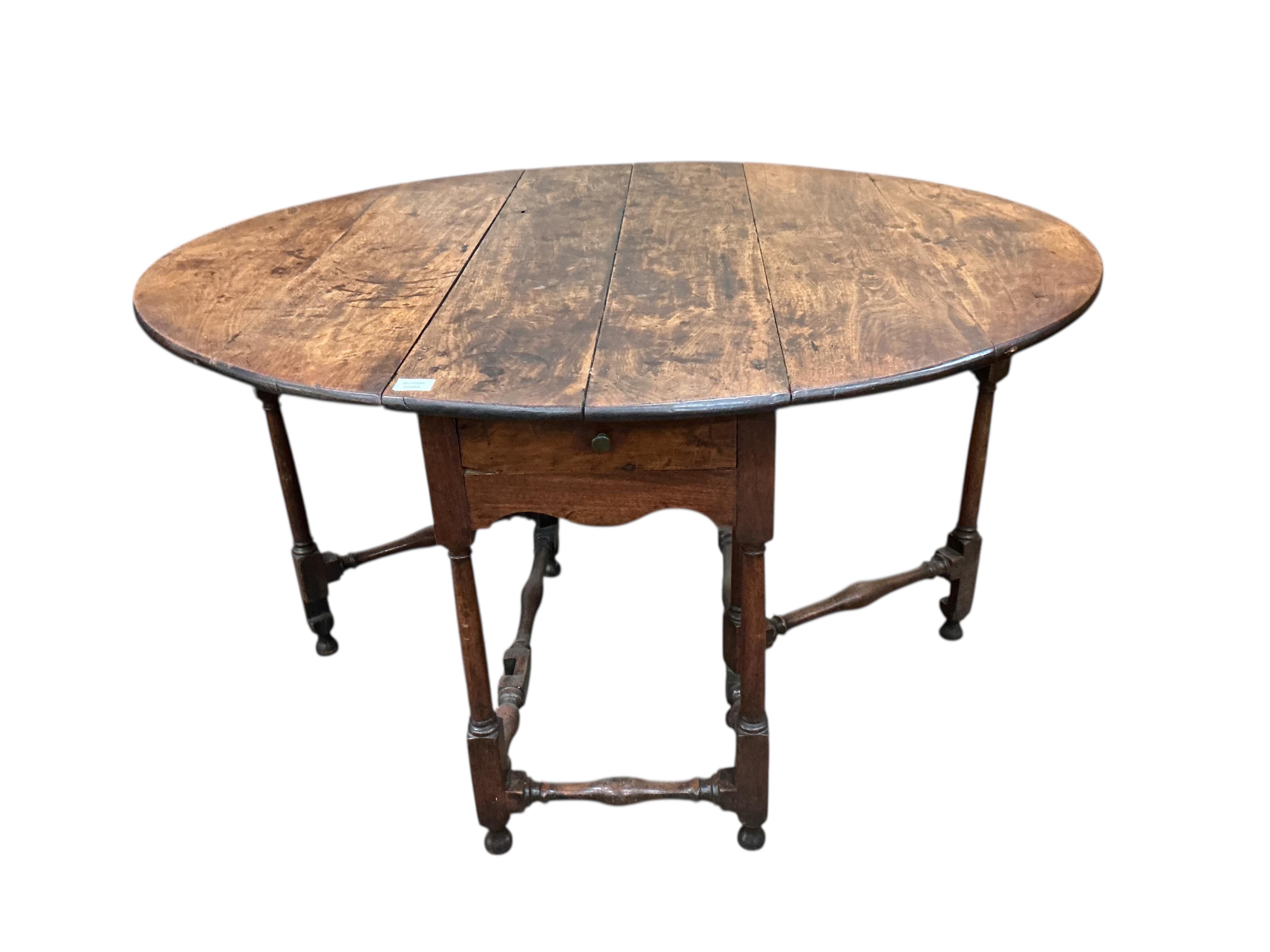An 17th / 18th century fruitwood gateleg table, width 116cm, depth 46cm, height 74cm